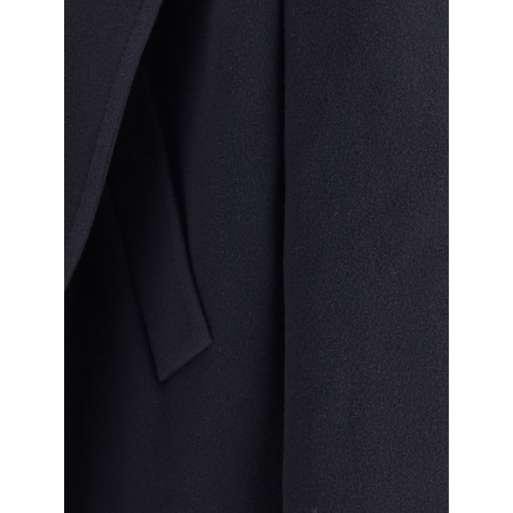 Hooded Short CoatThe hooded short Coat by Balenciaga blends tailored refinement with the brand’s contemporary edge. Crafted from dark navy brushed wool, it features a structured cut enhanced by shoulder pads and peak lapels, giving the silhouette a bold p