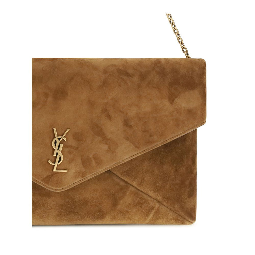 Beige Calf Leather Bos Taurus Shoulder BagThe Cassandre Shoulder Bag by Saint Laurent is an extra-large suede clutch with a sleek and contemporary design. Featuring a stowable cable chain and metallic CASSANDRE decoration, it can be worn on the shoulder o
