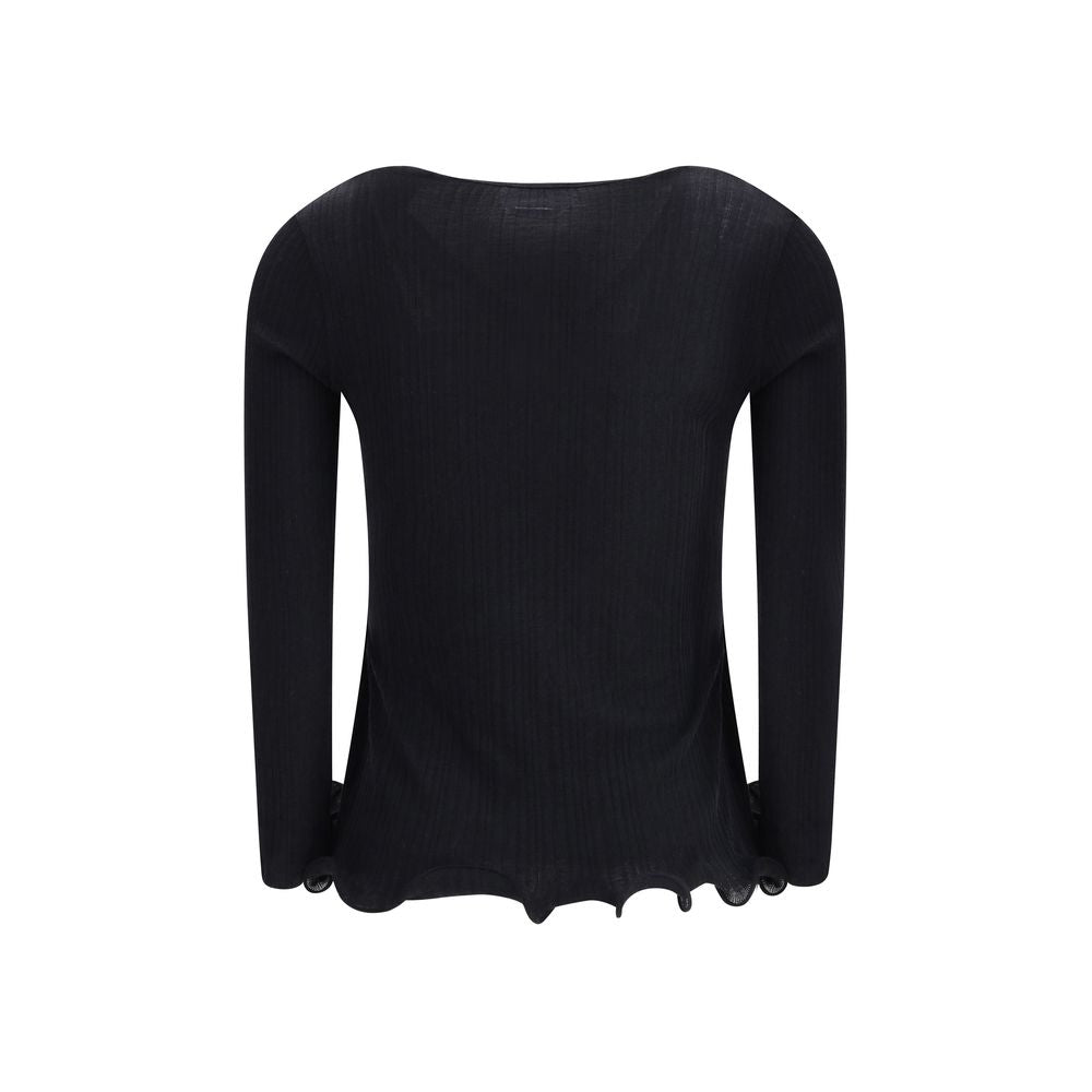 Black Fleece Wool TopThe long-sleeved Virgin Wool top by Fendi is an essential piece that combines refined simplicity with iconic details. Crafted from ribbed virgin wool, it features a fitted cut with a V-neckline, enhancing the silhouette with minimal e