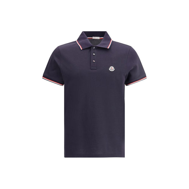 Polo shirtThe cotton piqué polo shirt by Moncler is a timeless classic that deserves a place in every wardrobe. Crafted from organic cotton, it combines comfort and sustainability with a clean, versatile style. The tricolor knit collar and cuffs add a dis