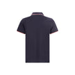 Polo shirtThe cotton piqué polo shirt by Moncler is a timeless classic that deserves a place in every wardrobe. Crafted from organic cotton, it combines comfort and sustainability with a clean, versatile style. The tricolor knit collar and cuffs add a dis