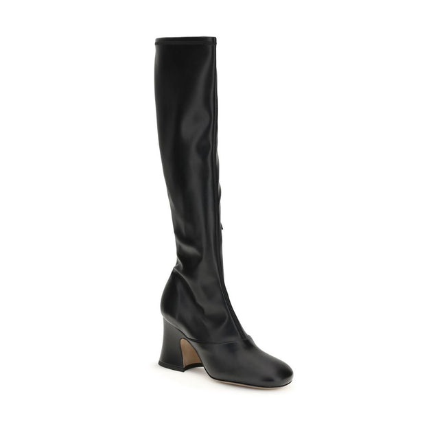 Black Leather High Heel BootsThe Janis heeled boots by Chloé are crafted from soft stretch fabric with a leather-effect finish, providing a second-skin fit. Featuring a stacked bell heel, they combine a high tubular design with a slightly squared toe for