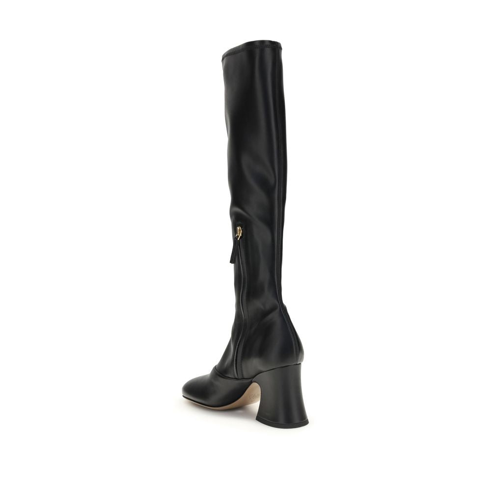 Black Leather High Heel BootsThe Janis heeled boots by Chloé are crafted from soft stretch fabric with a leather-effect finish, providing a second-skin fit. Featuring a stacked bell heel, they combine a high tubular design with a slightly squared toe for