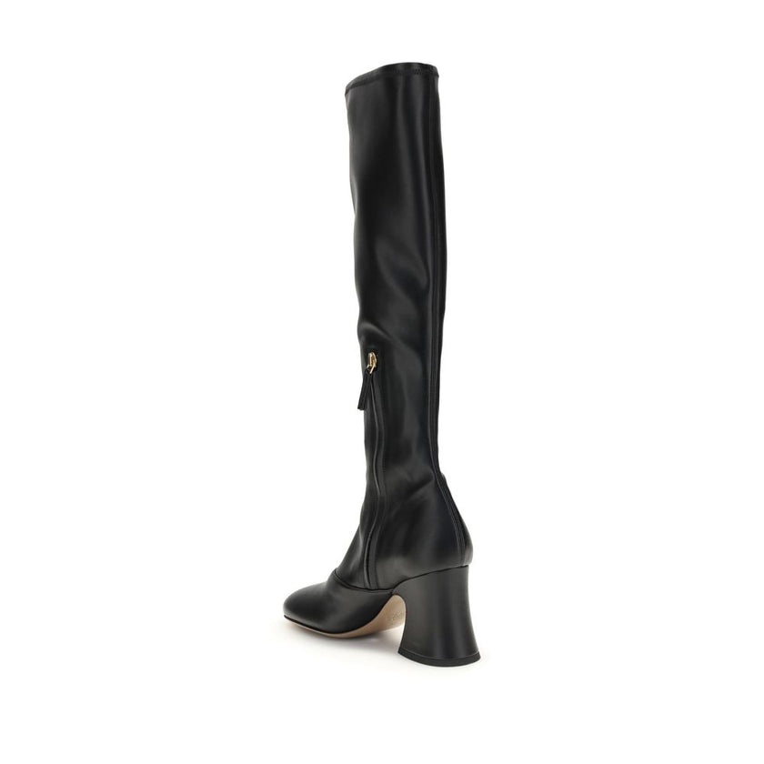 Black Leather High Heel BootsThe Janis heeled boots by Chloé are crafted from soft stretch fabric with a leather-effect finish, providing a second-skin fit. Featuring a stacked bell heel, they combine a high tubular design with a slightly squared toe for