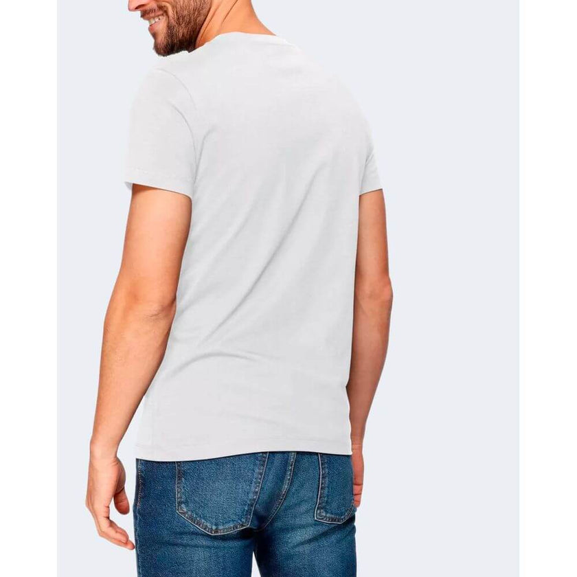 White Cotton ClothingDiscover the CORE MONOGRAM SLIM TEE short-sleeve t-shirt by Calvin Klein Jeans, an essential piece for your wardrobe. Made from 100% cotton, this t-shirt offers a soft and comfortable feel against the skin. The slim fit design enhance
