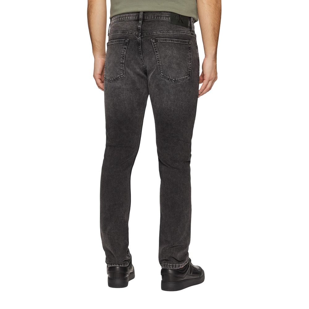 Gray Cotton Skinny JeansDiscover the Calvin Klein Jeans SLIM J30J326520 men’s slim fit jeans, crafted from high-quality materials: 94% cotton, 4% elastomultiester, and 2% elastane/lycra. These jeans offer a modern, tapered fit that is perfect for a stylis