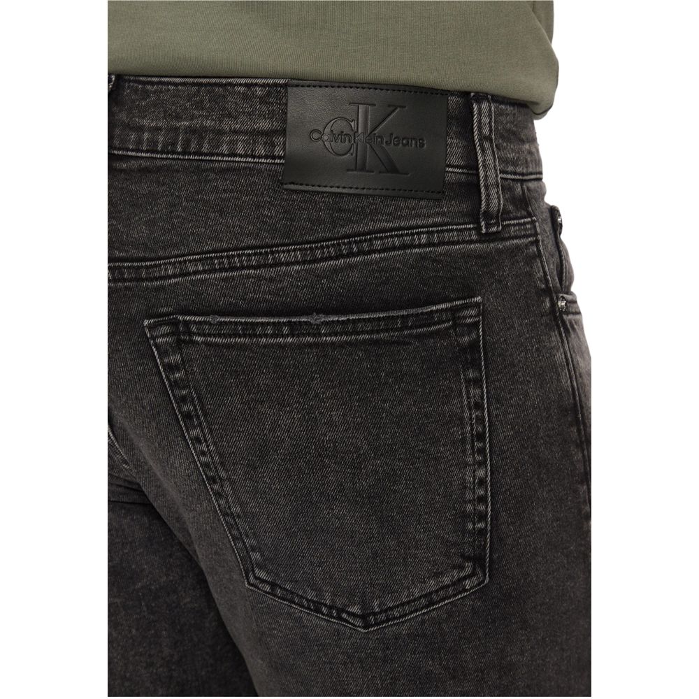 Gray Cotton Skinny JeansDiscover the Calvin Klein Jeans SLIM J30J326520 men’s slim fit jeans, crafted from high-quality materials: 94% cotton, 4% elastomultiester, and 2% elastane/lycra. These jeans offer a modern, tapered fit that is perfect for a stylis