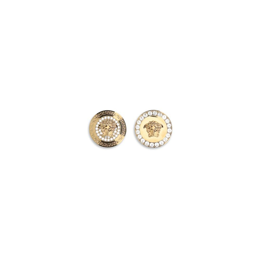 Gold Metal EarringsThe Crystal Medusa Earrings by Versace are small jewelry pieces featuring the iconic La Medusa emblem embellished with crystals. They showcase La Medusa hardware details, Greca engraving, and a butterfly clasp closure. Season: AW25 Comp