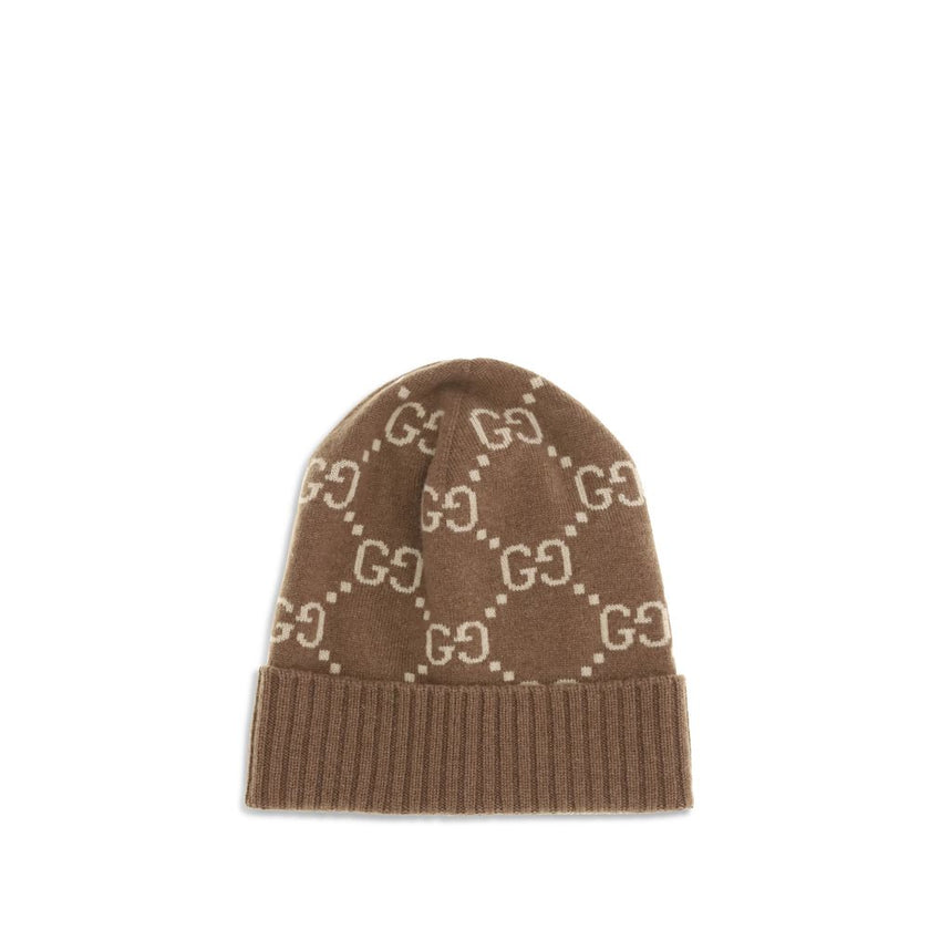 Brown Cashmere BeanieCashmere GG Hat by Gucci features a ribbed lapel and all-over GG logo print, combining elegance and comfort in an iconic and refined accessory. Season: AW25 Composition: 100% Kashmir/capra Hircus MADE IN ITALYBrown Cashmere Beanie${ta