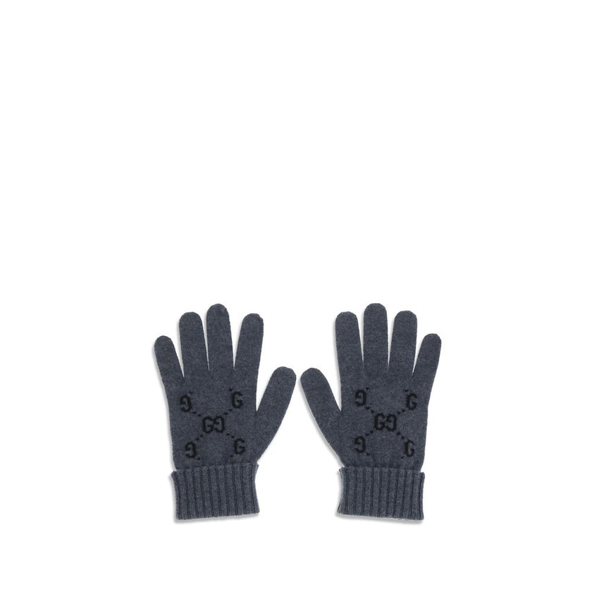 Gray Cashmere GlovesCashmere GG Gloves by Gucci feature a five-finger design and contrasting ribbed elastic cuff. The all-over print GG motif adds a distinctive and refined touch to this stylish and comfortable accessory. Season: AW25 Composition: 100% Ka