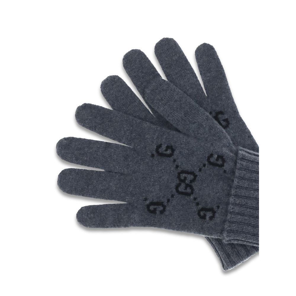 Gray Cashmere GlovesCashmere GG Gloves by Gucci feature a five-finger design and contrasting ribbed elastic cuff. The all-over print GG motif adds a distinctive and refined touch to this stylish and comfortable accessory. Season: AW25 Composition: 100% Ka