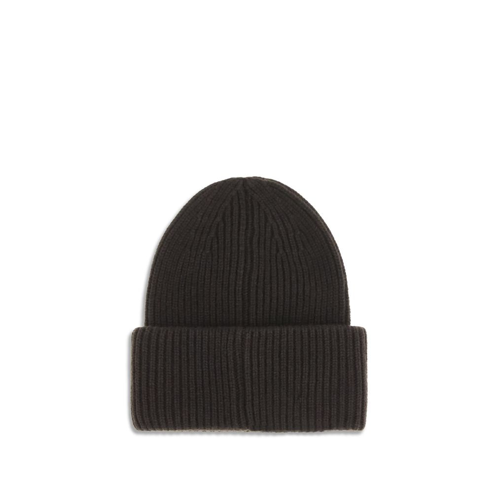 Black Wool BeanieThe beanie Hat by Moncler is crafted from a wool and cashmere blend with a brioche stitch that enhances its softness and style. The heavy knit ensures warmth and comfort, while the iconic felt patch on the front adds a distinctive and rec