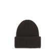 Black Wool BeanieThe beanie Hat by Moncler is crafted from a wool and cashmere blend with a brioche stitch that enhances its softness and style. The heavy knit ensures warmth and comfort, while the iconic felt patch on the front adds a distinctive and rec