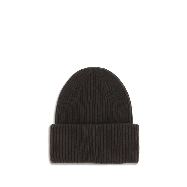 Black Wool BeanieThe beanie Hat by Moncler is crafted from a wool and cashmere blend with a brioche stitch that enhances its softness and style. The heavy knit ensures warmth and comfort, while the iconic felt patch on the front adds a distinctive and rec