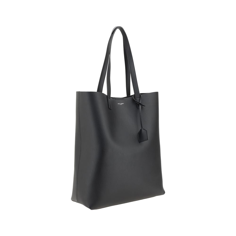 Black Calf Leather Bos Taurus HandbagThe Saint Laurent leather Tote Bag is a high-class piece, featuring an elegant and practical design. The two top handles make it easy to carry both by hand and on the shoulder, while the iconic contrasting monogram on