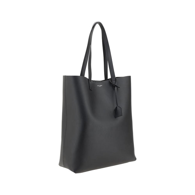 Black Calf Leather Bos Taurus HandbagThe Saint Laurent leather Tote Bag is a high-class piece, featuring an elegant and practical design. The two top handles make it easy to carry both by hand and on the shoulder, while the iconic contrasting monogram on