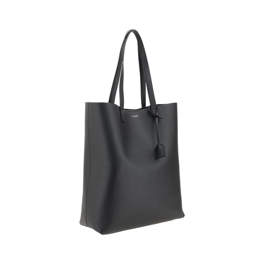 Black Calf Leather Bos Taurus HandbagThe Saint Laurent leather Tote Bag is a high-class piece, featuring an elegant and practical design. The two top handles make it easy to carry both by hand and on the shoulder, while the iconic contrasting monogram on