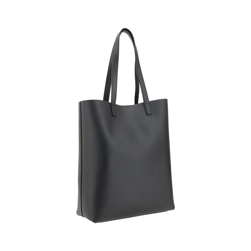 Black Calf Leather Bos Taurus HandbagThe Saint Laurent leather Tote Bag is a high-class piece, featuring an elegant and practical design. The two top handles make it easy to carry both by hand and on the shoulder, while the iconic contrasting monogram on