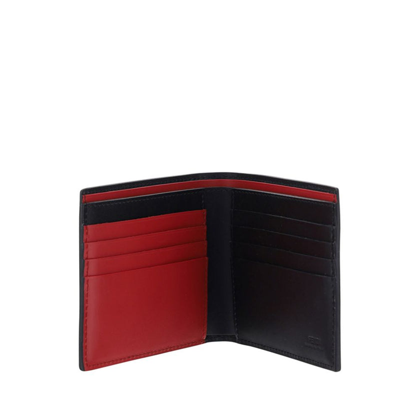Black Calf Leather Bos Taurus WalletFendi’s billfold leather Wallet is an elegant and practical accessory perfect for those seeking style and functionality. The two-tone design lends a modern touch, while the brand’s iconic signature press-stamped on the