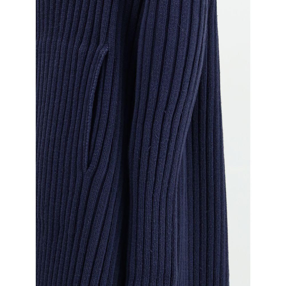 Blue Polyester Full-Length JacketThe Ribbed Shawl-Collar Cardigan by Balenciaga embodies understated luxury with its elongated silhouette and distinctive textural depth. Crafted in ribbed knit, it wraps the body with fluid ease, while the generous shawl c