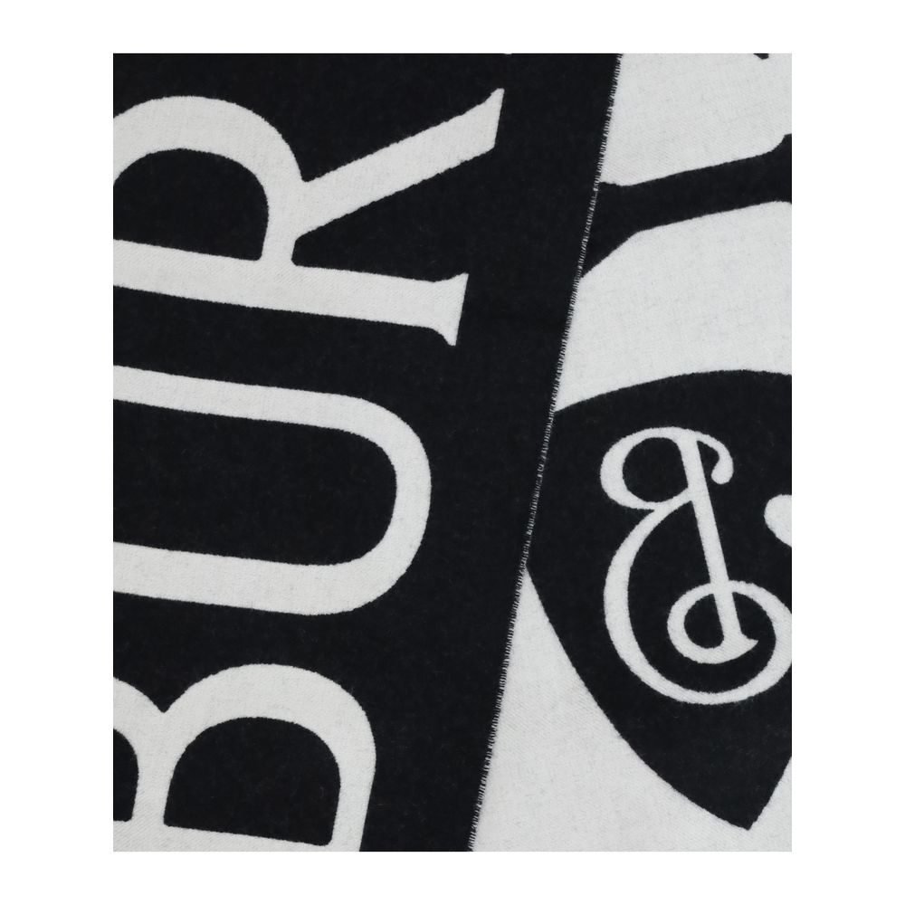 Black Wool ScarfWool logo Scarf by Burberry is a refined accessory with a graphic, contemporary style. Made in Italy from soft two-tone wool, it is decorated with Burberry lettering and the B Shield jacquard pattern, inspired by the iconic Equestrian Knig