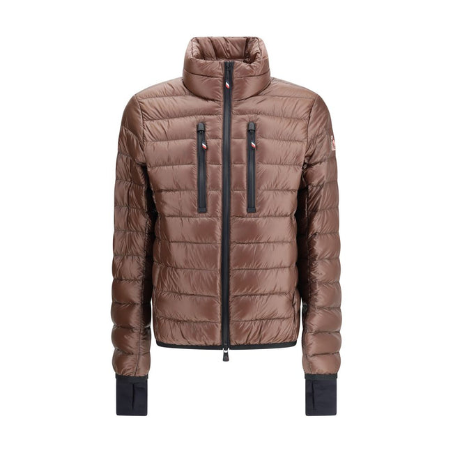 Brown Polyamide CoatThe Hers Jacket by Moncler Grenoble is a lightweight and functional piece designed to provide protection and practicality for any outdoor activity. Made from technical nylon, it features a high collar and a double-slider front zip with