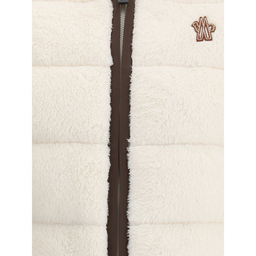 Padded Polartec® Zip-Up HoodieThe Moncler Grenoble Padded Polartec® Zip-Up Hoodie is designed for trekking and outdoor performance, blending function with comfort. Crafted from Polartec® High Loft™ stretch velour, it features a padded front and quilted de