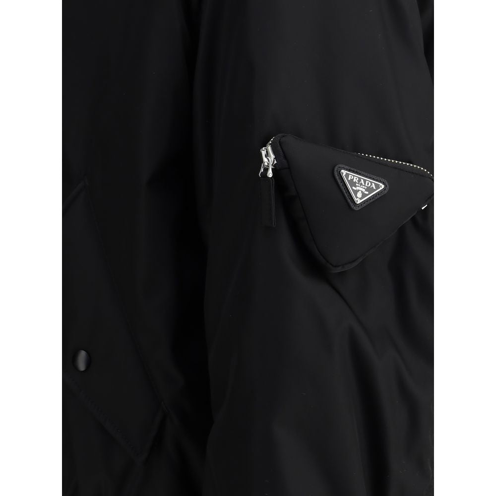 Black Polyamide BomberThe Prada Re-Nylon Bomber redefines a timeless silhouette with the house’s innovative sustainable fabric. Featuring a front zip closure, long sleeves with a classic utility-style zip pocket, and two side flap pockets, it combines fun