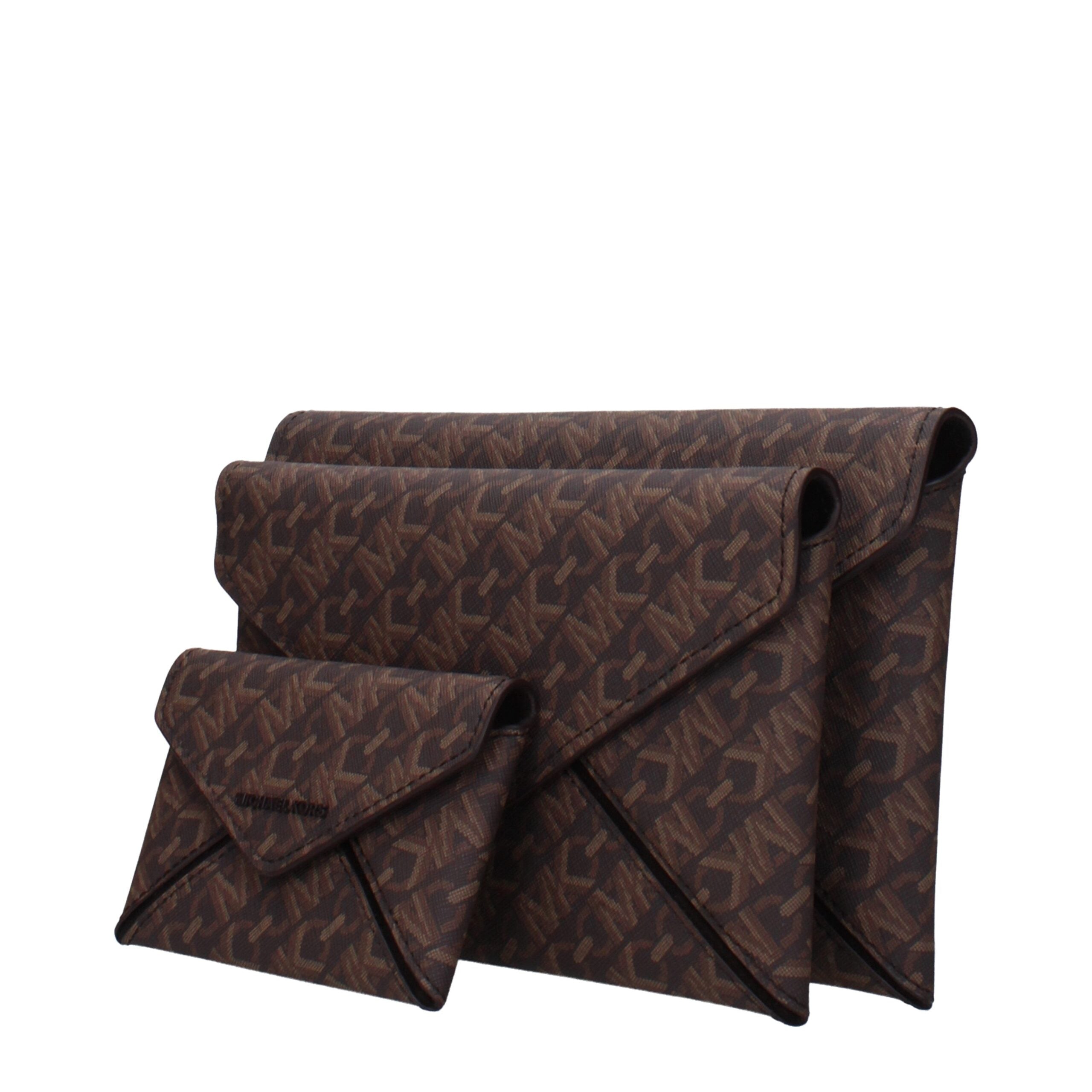 Brown Fabric Clutch BagDescription: The product with MPN 32F4T9JD7BBROWN and code F85040 fabric in brown is a clutches designed by Michael Kors. It has features like logo, 2 inner clutch removable.Brown Fabric Clutch Bag${tagsMichael KorsAulae Brown Fabri
