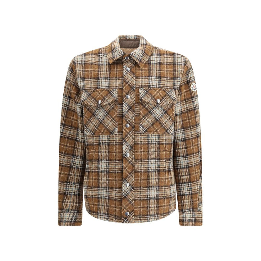 Brown Fleece Wool Jackets And CoatThe checked wool Overshirt by Monlcer captures the spirit of outdoor leisure. Crafted from soft checked wool, it balances practicality and style with its buttoned collar, zip closure, chest pocket with zip and snap button