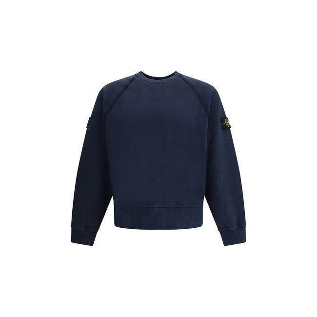 Blue Cotton SweatshirtThe Crew neck Sweatshirt by Stone Island is crafted from brushed organic cotton, offering a soft feel and a sustainable approach. Its design features raglan sleeves, overlock seams, and stretch ribbed finishes at cuffs and straight h