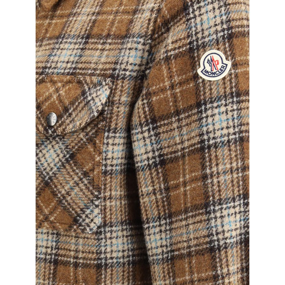 Brown Fleece Wool Jackets And CoatThe checked wool Overshirt by Monlcer captures the spirit of outdoor leisure. Crafted from soft checked wool, it balances practicality and style with its buttoned collar, zip closure, chest pocket with zip and snap button
