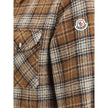 Brown Fleece Wool Jackets And CoatThe checked wool Overshirt by Monlcer captures the spirit of outdoor leisure. Crafted from soft checked wool, it balances practicality and style with its buttoned collar, zip closure, chest pocket with zip and snap button