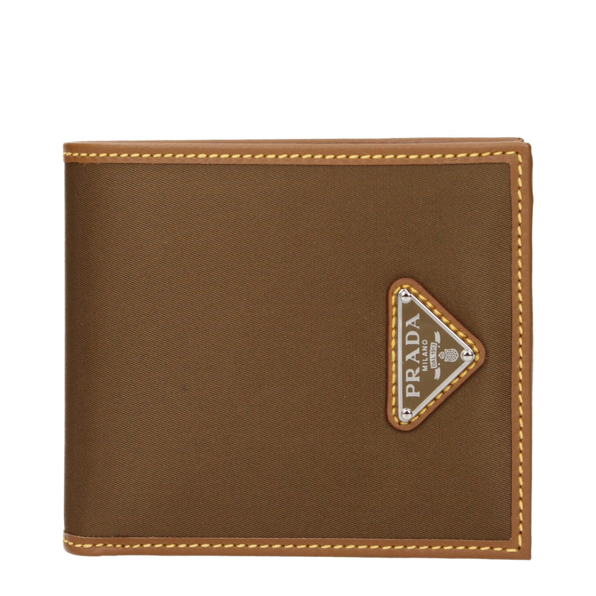 Brown Fabric WalletDescription: The product with MPN 2MO5132CX201F0594 and code F84481 fabric in brown is a wallets designed by Prada. It has features like front logo.Brown Fabric Wallet${tagsPradaAulae Brown Fabric Wallets PradaAulae Brown Fabric Wallets