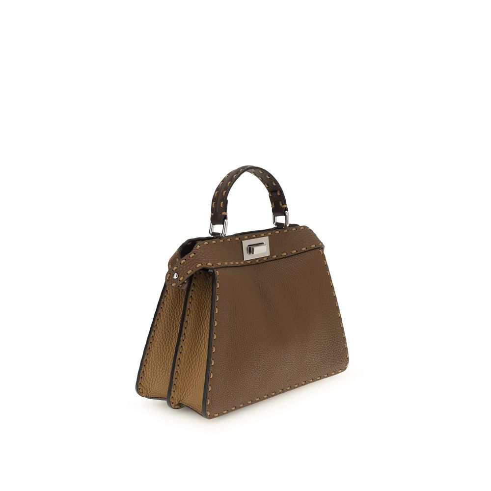 Brown Leather Shoulder BagThe Peekaboo ISeeU small Handbag by Fendi is crafted from brown Cuoio Romano leather with cappuccino-colored side panels, featuring a natural grain achieved through a metal-free tanning process.The leather-lined interior is divid