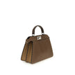 Brown Leather Shoulder BagThe Peekaboo ISeeU small Handbag by Fendi is crafted from brown Cuoio Romano leather with cappuccino-colored side panels, featuring a natural grain achieved through a metal-free tanning process.The leather-lined interior is divid