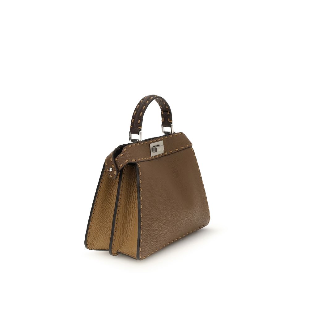 Brown Leather Shoulder BagThe Peekaboo ISeeU small Handbag by Fendi is crafted from brown Cuoio Romano leather with cappuccino-colored side panels, featuring a natural grain achieved through a metal-free tanning process.The leather-lined interior is divid