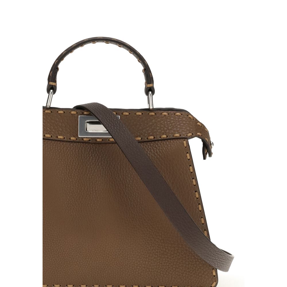 Brown Leather Shoulder BagThe Peekaboo ISeeU small Handbag by Fendi is crafted from brown Cuoio Romano leather with cappuccino-colored side panels, featuring a natural grain achieved through a metal-free tanning process.The leather-lined interior is divid