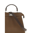 Brown Leather Shoulder BagThe Peekaboo ISeeU small Handbag by Fendi is crafted from brown Cuoio Romano leather with cappuccino-colored side panels, featuring a natural grain achieved through a metal-free tanning process.The leather-lined interior is divid