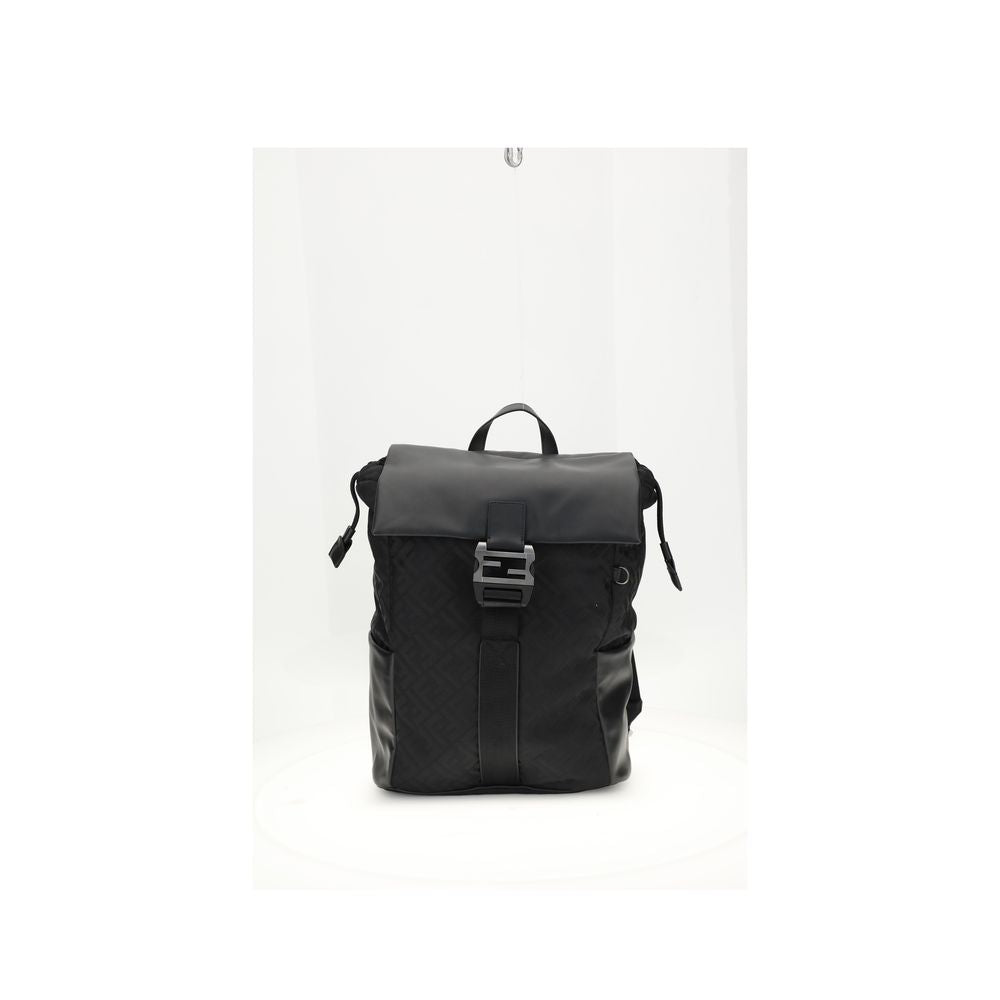Black Nylon Shoulder BagNylon Flux Backpack by Fendi has a bold, contemporary style, embellished with all-over FF embroidery and a front metal FF logo buckle. Made of nylon with smooth calfskin inserts, it features a tonal leather handle, adjustable fabri