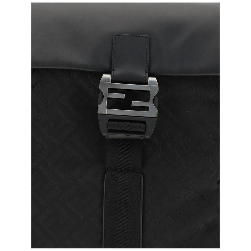 Black Nylon Shoulder BagNylon Flux Backpack by Fendi has a bold, contemporary style, embellished with all-over FF embroidery and a front metal FF logo buckle. Made of nylon with smooth calfskin inserts, it features a tonal leather handle, adjustable fabri