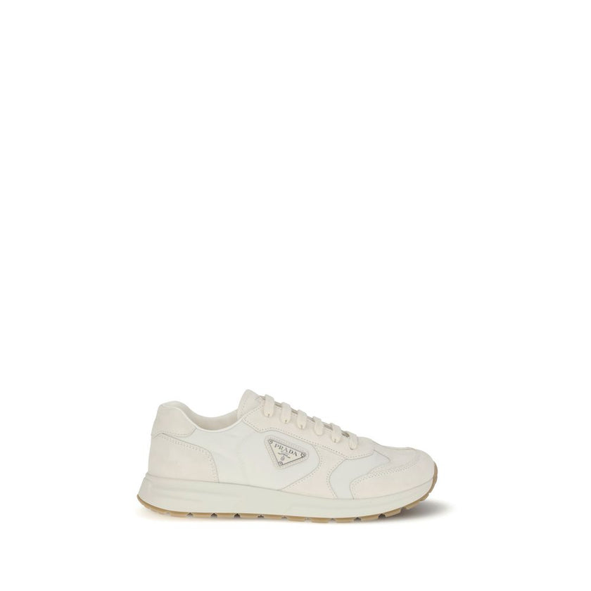 Cream Recycled Polyamide Athletic SneakersPrax 01 re-nylon Sneakers by Prada blend contemporary aesthetics and innovative materials. The upper with nylon lace loops lends a technical, modern look, enhanced by the enameled metal triangle logo and screen-pr