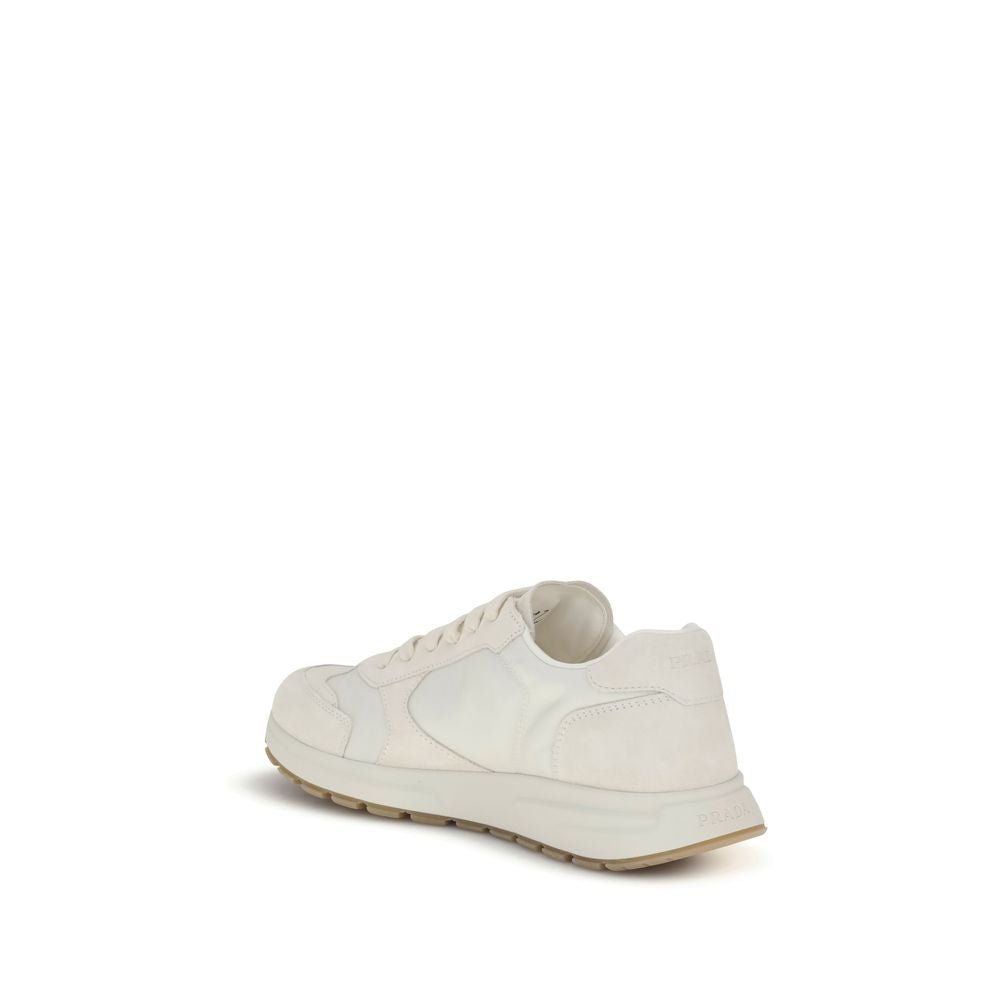 Cream Recycled Polyamide Athletic SneakersPrax 01 re-nylon Sneakers by Prada blend contemporary aesthetics and innovative materials. The upper with nylon lace loops lends a technical, modern look, enhanced by the enameled metal triangle logo and screen-pr