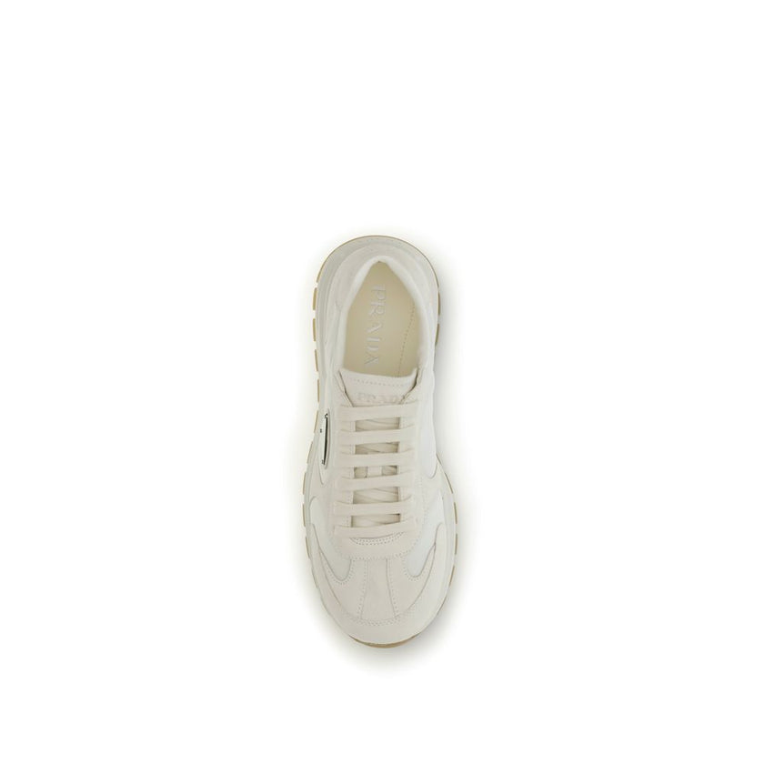 Cream Recycled Polyamide Athletic SneakersPrax 01 re-nylon Sneakers by Prada blend contemporary aesthetics and innovative materials. The upper with nylon lace loops lends a technical, modern look, enhanced by the enameled metal triangle logo and screen-pr