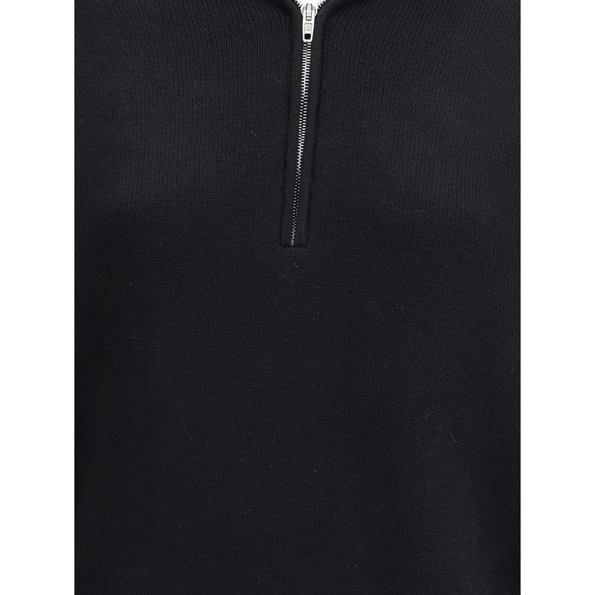 Black Cotton SweatshirtThe Back-to-Front Sweater by Balenciaga, crafted from heavy Cotton, features a distinctive design with a turned-up turtleneck and half zip at the back. Completed with practical pockets, long cuffed sleeves, and dropped shoulders, it
