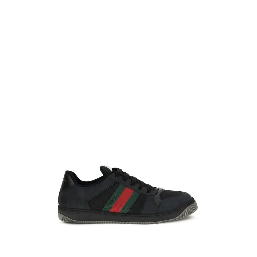 Black Calf Leather Bos Taurus SneakersScreener Sneakers by Gucci are made of leather, with a round toe for comfort and a lace-up front closure for a customized fit. The side panels are embellished with the iconic colored webbing bands, a distinctive detai