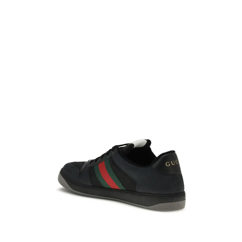 Black Calf Leather Bos Taurus SneakersScreener Sneakers by Gucci are made of leather, with a round toe for comfort and a lace-up front closure for a customized fit. The side panels are embellished with the iconic colored webbing bands, a distinctive detai