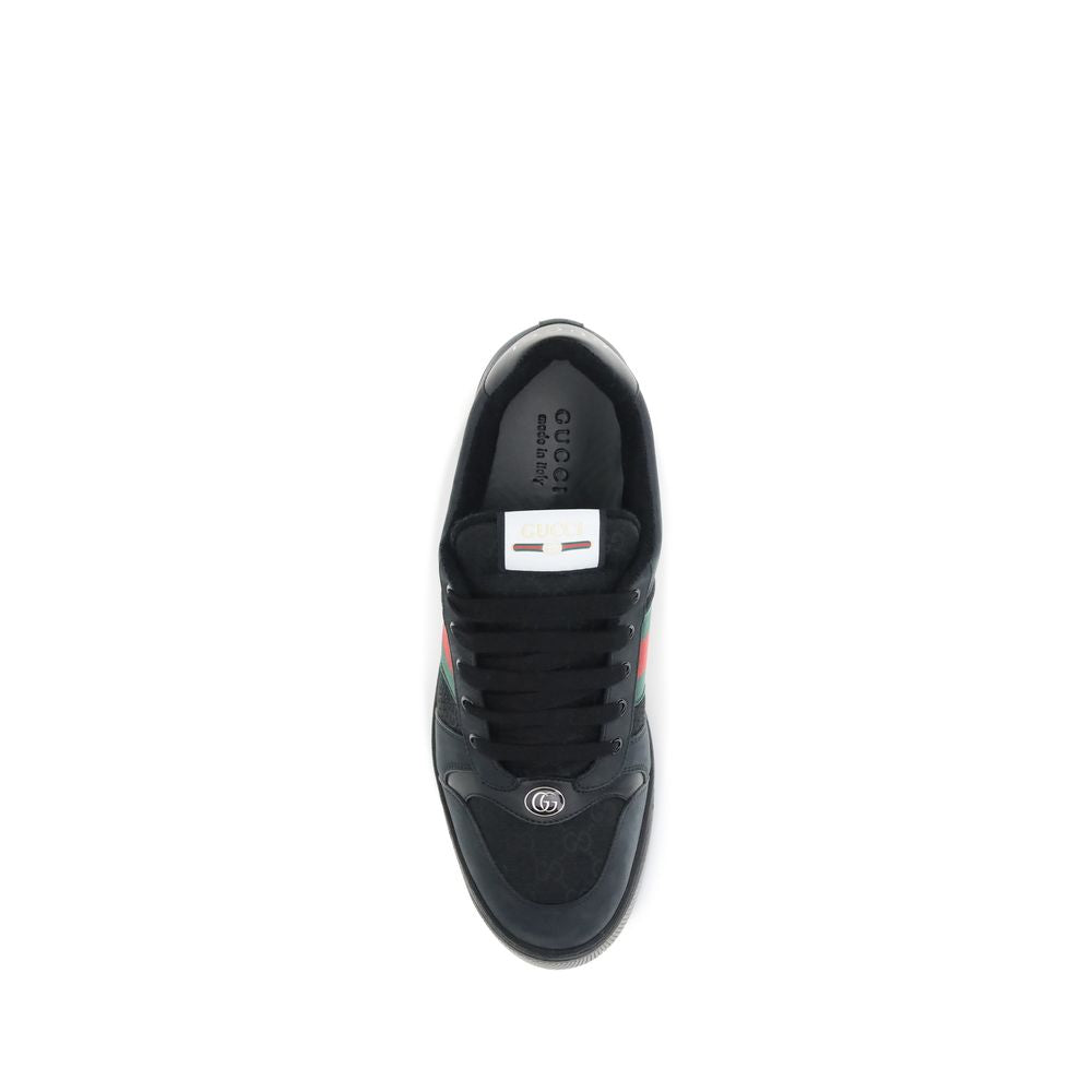 Black Calf Leather Bos Taurus SneakersScreener Sneakers by Gucci are made of leather, with a round toe for comfort and a lace-up front closure for a customized fit. The side panels are embellished with the iconic colored webbing bands, a distinctive detai