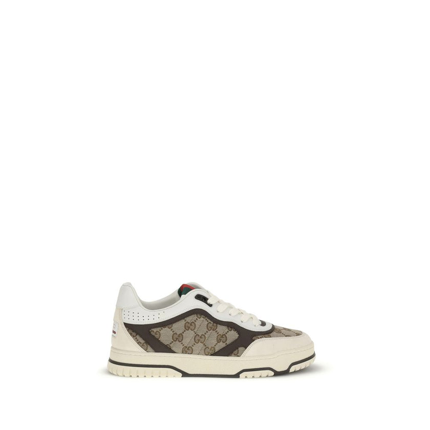 Beige Fabric Low Top SneakersRe-Web Sneakers by Gucci are a blend of urban style and sophistication, with distinctive details that recall the brand’s identity. The front lace-up closure ensures a comfortable and adjustable fit, while the brand’s iconic si