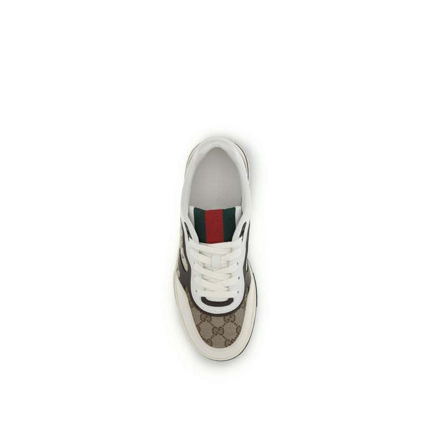 Beige Fabric Low Top SneakersRe-Web Sneakers by Gucci are a blend of urban style and sophistication, with distinctive details that recall the brand’s identity. The front lace-up closure ensures a comfortable and adjustable fit, while the brand’s iconic si